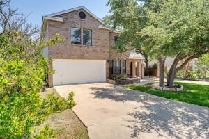 a brick house with a white garage at Luxe San Antonio Vacation Rental with Private Pool! in San Antonio