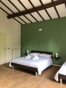 Postel nebo postele na pokoji v ubytování Agriturismo Tra Le Colline