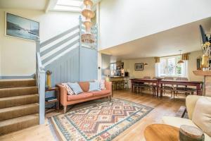 a living room with a couch and a table at The Old Forge, Great Glemham in Great Glemham