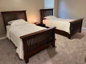 two beds in a room with two beds sidx sidx sidx sidx at Ecstatic Town Home In Stone Mountain in Stone Mountain