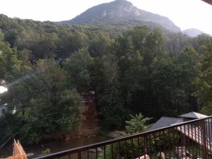 a view of a mountain from a balcony at Carter Lodge - On The River in Chimney Rock