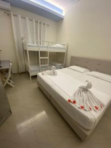 Postel nebo postele na pokoji v ubytování FA_HOLIDAYS