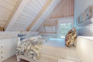 a bedroom with a bed in a attic at Tranquil Haven in West Tisbury