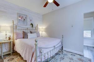 a bedroom with a bed and a ceiling fan at Spring Bungalow - A cozy getaway in downtown Hot Springs! in Hot Springs