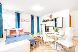 a bedroom with a bed and a table and chairs at Modern apartment with free garage and balcony in the downtown in Budapest