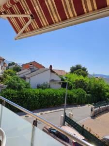 a view of a street from a balcony at Val in Kaštela