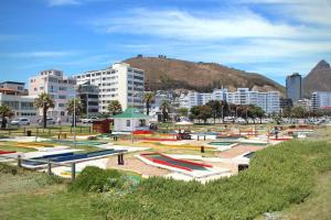 a park with many different colored boats in a city at 16 Serenity Studio - Dolphin Bay in Cape Town