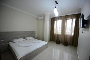 Postel nebo postele na pokoji v ubytování Nana's Hotel Tchaikovsky Street 34 + 5 fotografií