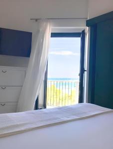 Voodi või voodid majutusasutuse Terrazza Diomede Manfredi Homes&Villas toas