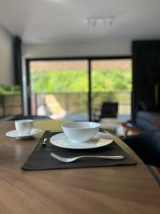 Příslušenství pro přípravu čaje a kávy v ubytování Apartment 23