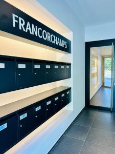 a store with lockers and a door in a room at Route du Circuit 23 in Stavelot
