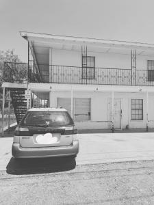 a car parked in front of a building at The Sinaí Apartment is Cozy Place in Eagle Pass