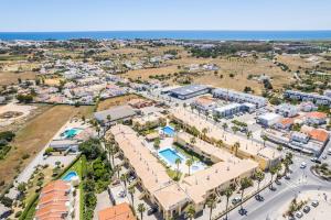 an aerial view of a resort with the ocean in the background at Benjamin Apartment in Guia