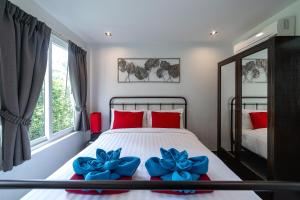 Postel nebo postele na pokoji v ubytování Siam Royal View Villas