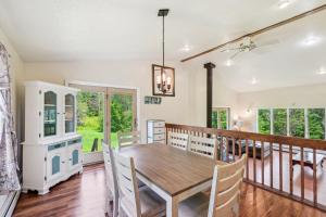 a dining room with a table and chairs at Charming and Scenic Gouldsboro Getaway with Patio! in Gouldsboro
