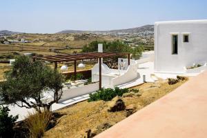 a villa with a view of the valley at Myconian Mythodea Luxury Villa in Ano Mera