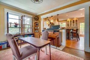 a kitchen and dining room with a table and chairs at Pet-Friendly Fort Thomas Vacation Rental with Deck! 