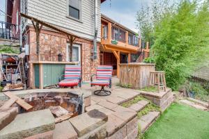 a patio with three chairs and a pond in front of a house at Pet-Friendly Fort Thomas Vacation Rental with Deck! 