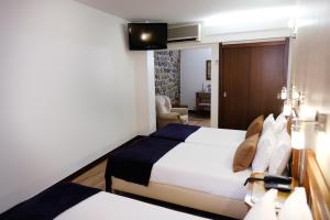 Postel nebo postele na pokoji v ubytování Hotel Dona Sofia + 37 fotografií