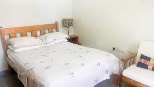 Postel nebo postele na pokoji v ubytování Coco Mango Suites
