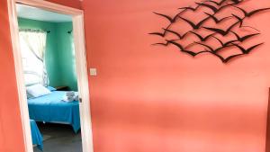 Postel nebo postele na pokoji v ubytování Coco Mango Suites
