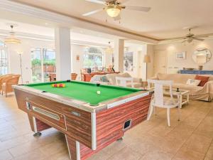 a living room with a pool table in it at Villa Fuente Verde in Marbella