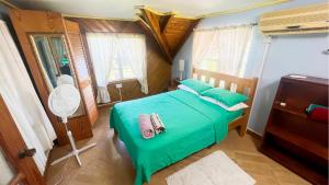 Postel nebo postele na pokoji v ubytování Coco Mango Suites