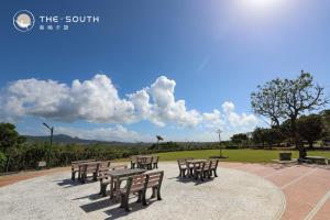 a group of benches sitting in a park at The South-Dawn in Hengchun
