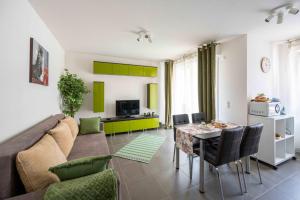 a living room with a couch and a table at Superbe Loft Center of Saverne Bike Parking in Saverne