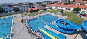 an overhead view of a pool with a water park at Apartmán Viktorie in Mikulov