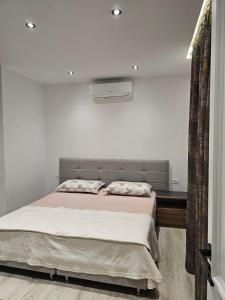 Een bed of bedden in een kamer bij Vila 4G