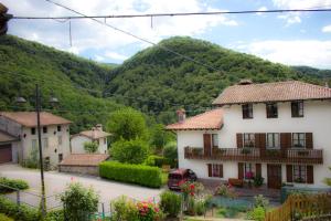 a view of a village with mountains in the background at Casa Natura e Quiete in Stregna +8 photos