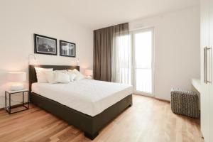 Postel nebo postele na pokoji v ubytování Lunas Appartements Essen
