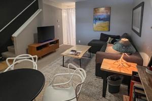 a living room with a couch and a tv at 2404 Pitchfork in Jackson