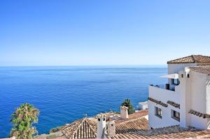 a view of the ocean from a building at Comeback LA CASA DEL SOL NACIENTE in Salobreña
