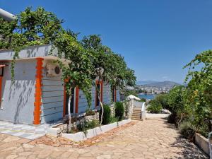 a house with a pathway next to a building at Seaside Ksamil in Ksamil