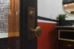 a door with a brass door knob on a room at The Cat's Meow Apt 1 Sunset Heights in El Paso