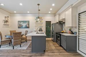 a kitchen with a sink and a counter top at Updated 1Br 1Ba Condo in the Kiahuna Plantation Resort near Poipu Beach 430 in Koloa