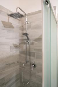 a shower with a shower head in a bathroom at Casa Della Nonna in Manfredonia