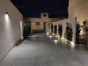 an empty driveway in front of a house at night at Agata in Galatina