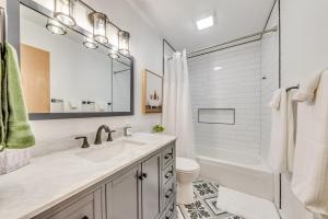 a bathroom with a sink and a toilet and a mirror at Cloudcroft Mountain Retreat about 5 Mi to Skiing! in Cloudcroft +22 photos