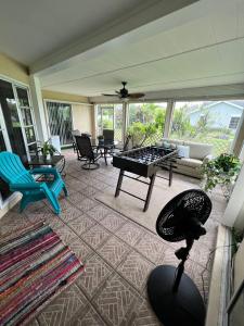 a living room with a ping pong table at Super Comfy " Arcade" Home in Cape Coral, Great Location! in Cape Coral