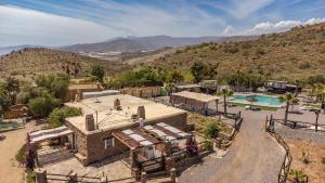 an aerial view of a house with a swimming pool at Paraje la Suerte Apartamento Crisantemo in Adra