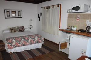 En eller flere senger på et rom på Cabañas Santa Rita