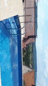 a view of a building and a swimming pool at Stone Pearl in Posušje