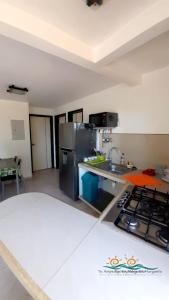 Kuchyň nebo kuchyňský kout v ubytování Posada Villa Mayo Apartamento7 familiar a 5 Min de Playa Parguito