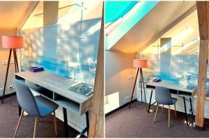 a room with two desks with chairs and two lamps at Self Check-In Loft in Klaipeda city centre Free Parking in Klaipėda