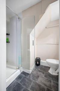 a bathroom with a shower and a toilet and a sink at Private retreat for 3 Near Arndale City Centre in Manchester