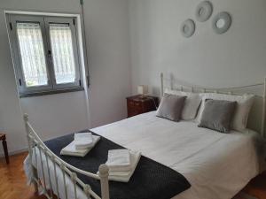 Postel nebo postele na pokoji v ubytování Casa da Avó Laurinda