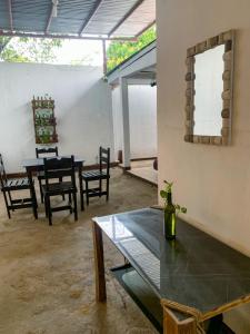 a dining room with a table and chairs at 8 Habitaciones in Managua